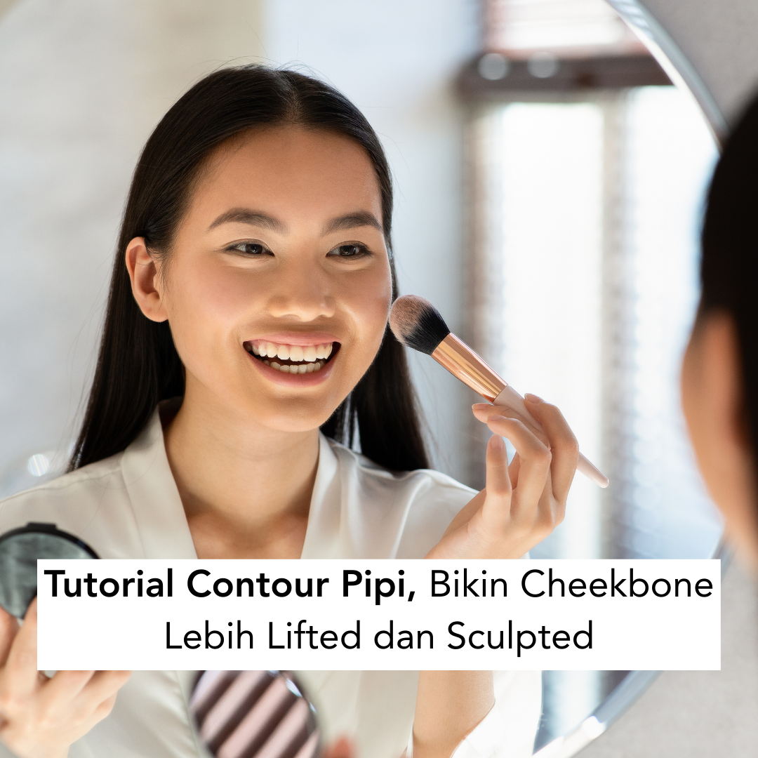 Perempuan sedang bercermin dan membuat contour pipi